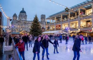 Friends ice skating at the Liverpool ONE Christmas rink